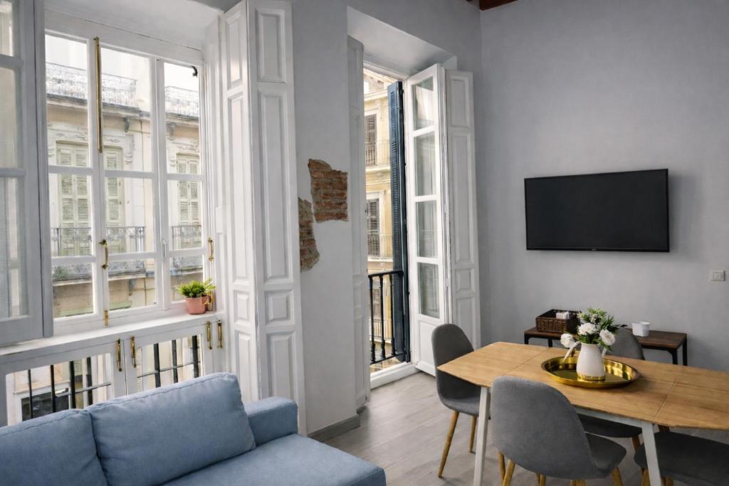 Un dormitorio en Heredia Suites Catedral1